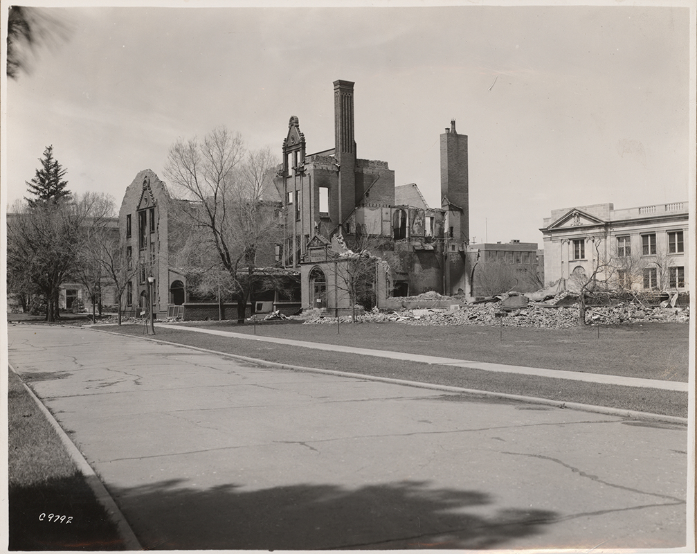 Photograph showing the southeast portion of Margaret Hall after it was destroyed by fire on April 9, 1938. MacKay Hall can be seen to the north (right).