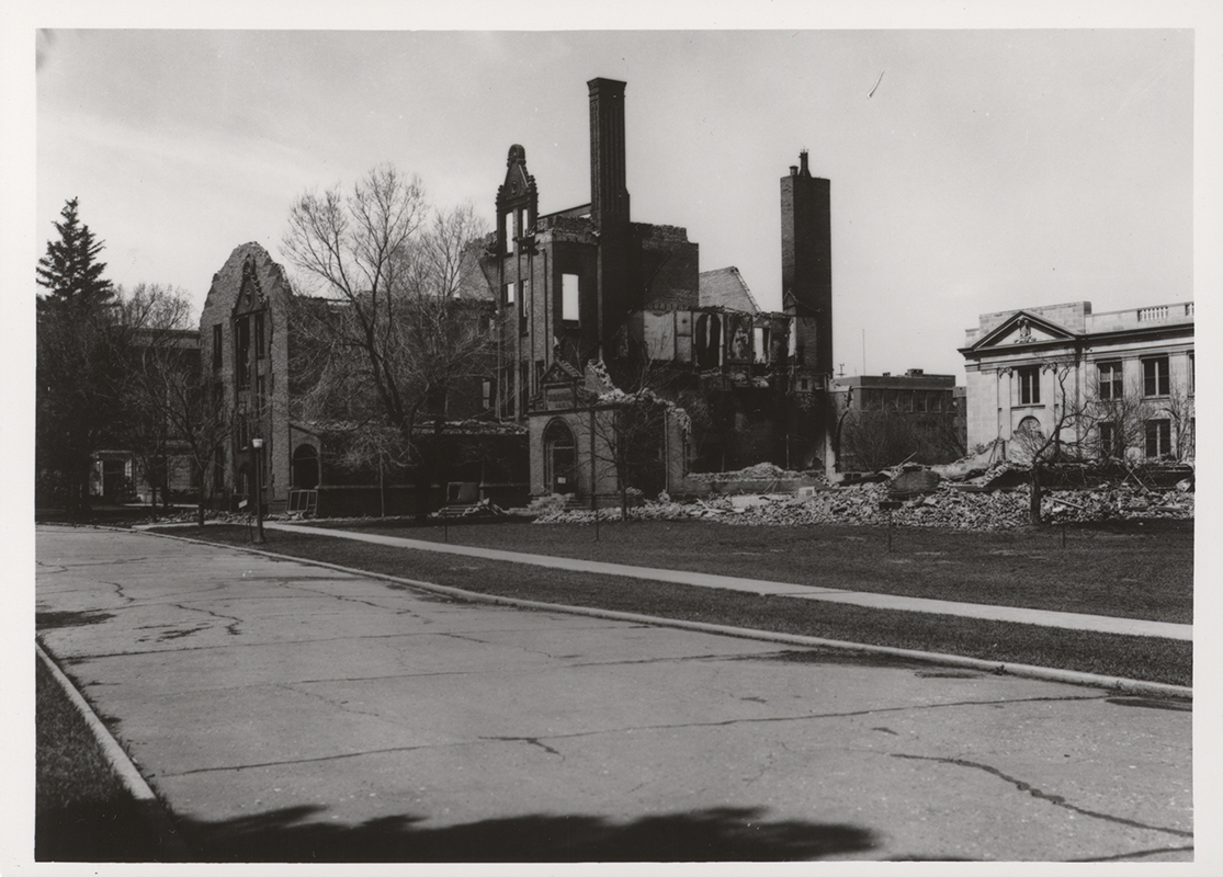 Photograph showing the southeast portion of Margaret Hall after it was destroyed by fire on April 9, 1938. MacKay Hall can be seen to the north (right).