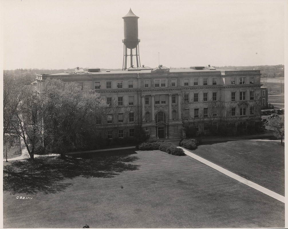 Photograph of the east side of Marston Hall with the Marston Water Tower rising up behind it.