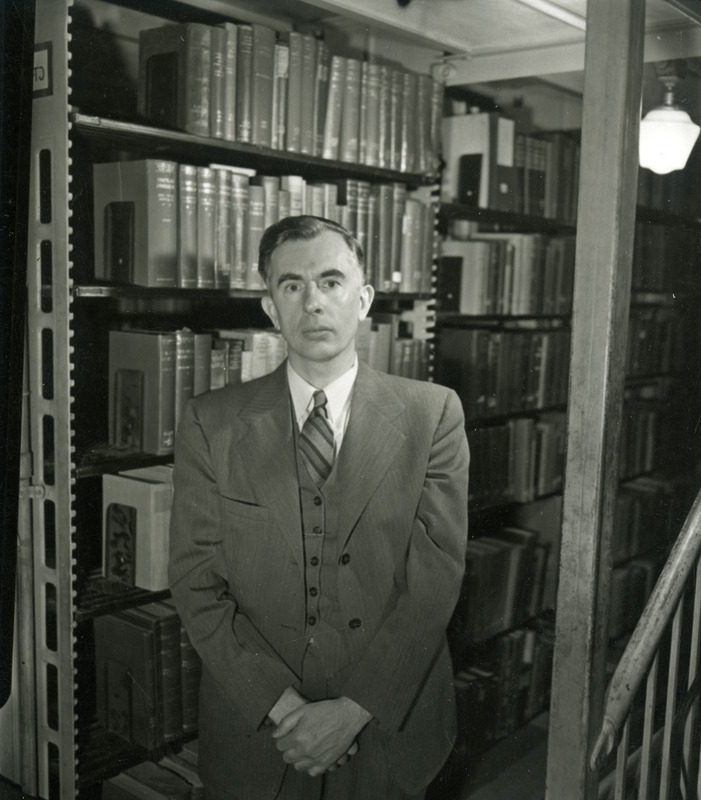 Robert W. Orr, Professor and Director of Library, poses for a portrait in the library tiers.