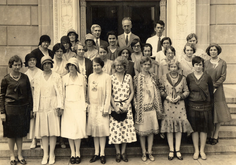 The library staff in this portrait taken in 1925. Charles H. Brown is the center man in the back row. On his right is Robert Orr, who succeeded Dr. Brown as director. Some of the other longtime staff members pictured are: Evelyn Wimersberger, left at the end of the third row; Frances Warner, center of the front row holdings purse; Mary Rhea Barron, right end of the second row; and grace Oberheim, second from the right in the third row.