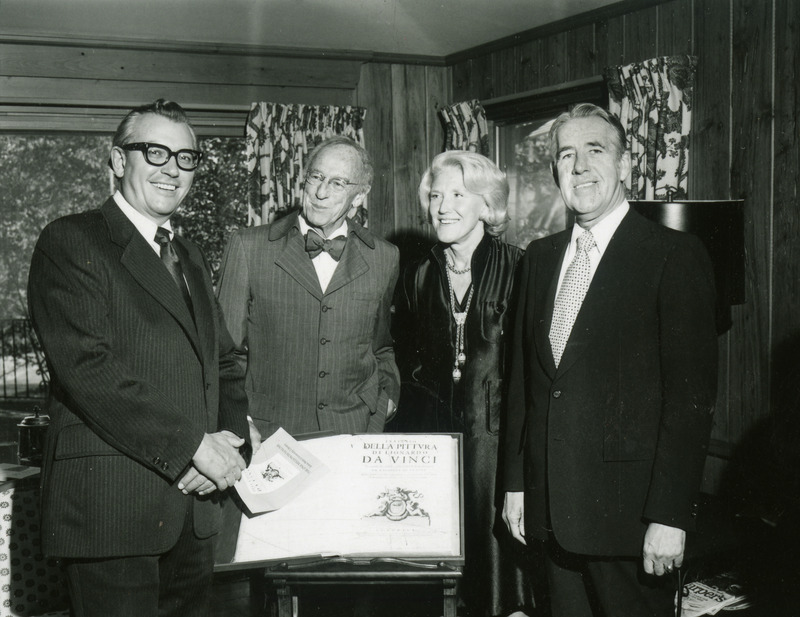 William Robert Parks,Warren Kuhn and library staff members pose with the one millionth book acquired by the library.