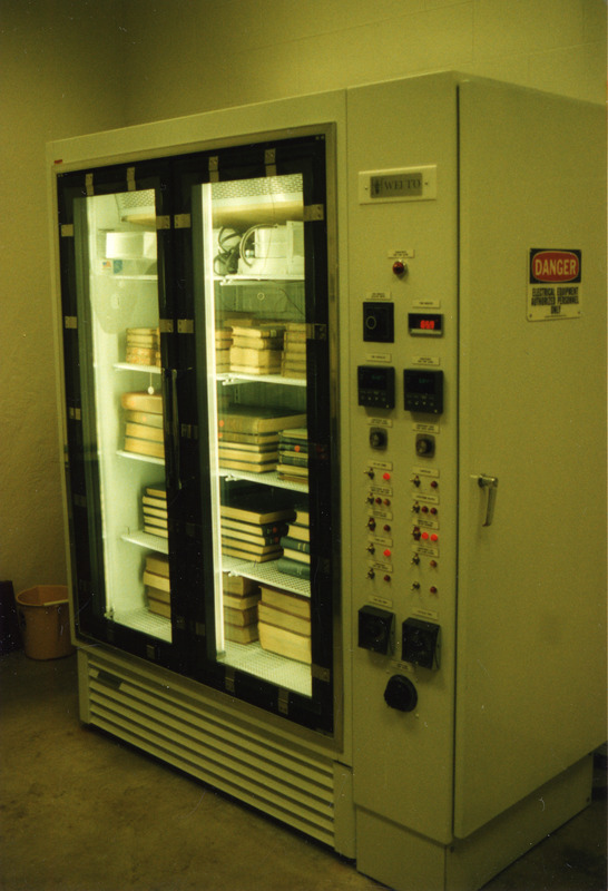 The Library preservations freeze drier, located at library storage building is full of materials undergoing preservation treatment.