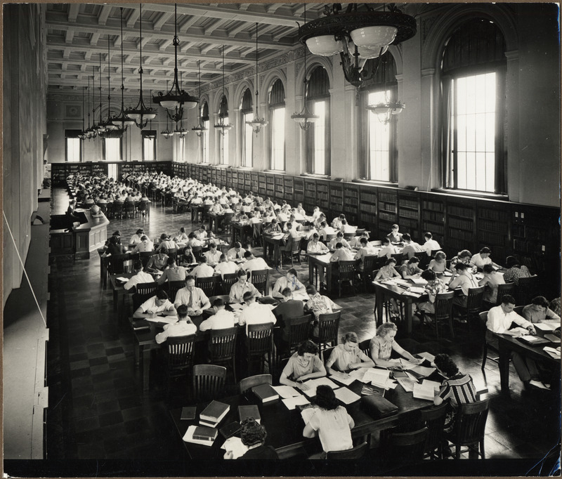 Tables of students are viewed from above in the library's Main Reading Room (currently called the Periodical Room).