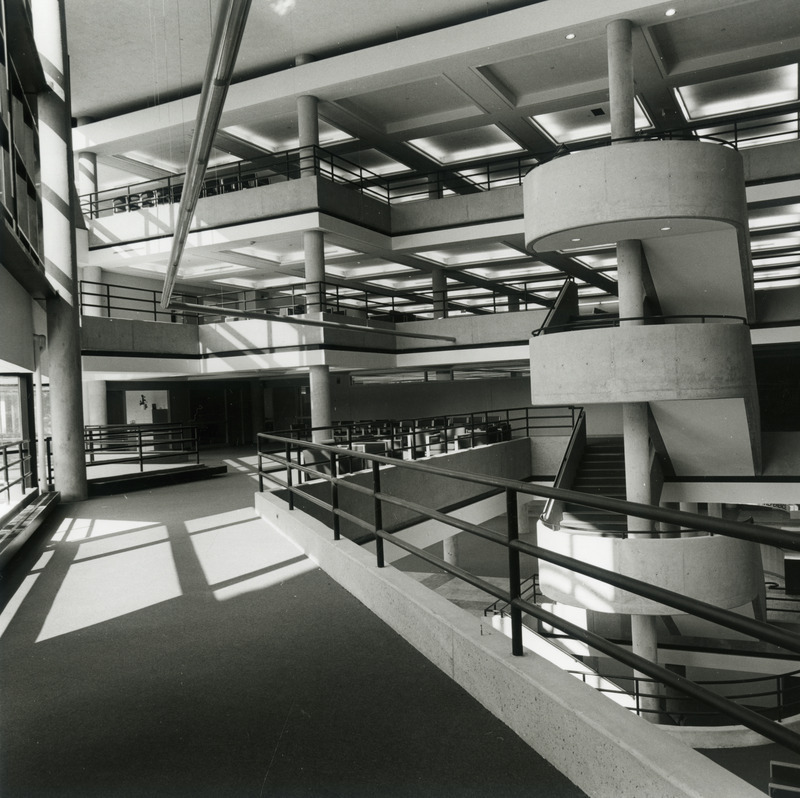 The circular staircase in the 3rd Addition is viewed from the second floor bridge soon after completion, before all the furniture has been put in place. The addition may not yet be open to the public because on the first floor, the card catalog area is empty.