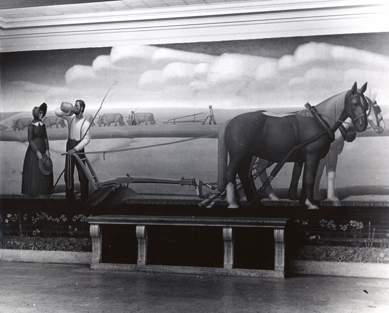 The main panel of the Grant Wood mural "Breaking the Prairie" is shown on the first floor of the library.