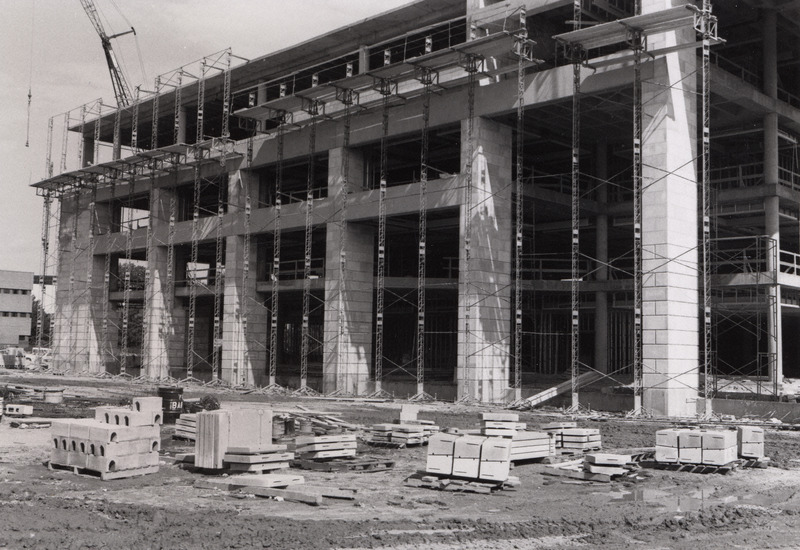 Scaffolding surrounds the south view of the 3rd addition construction.