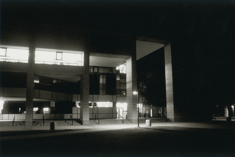 The inside lighting of the library contrasts with the dark outside the main (south) entrance to the Library.