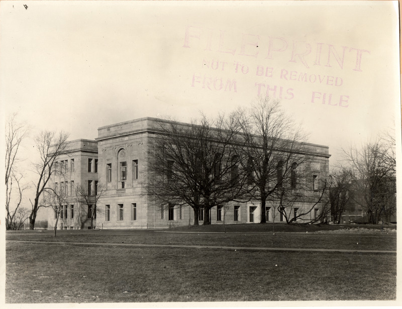 A long-range view from the southeast of the newly constructed library. The trees around the building are bare.