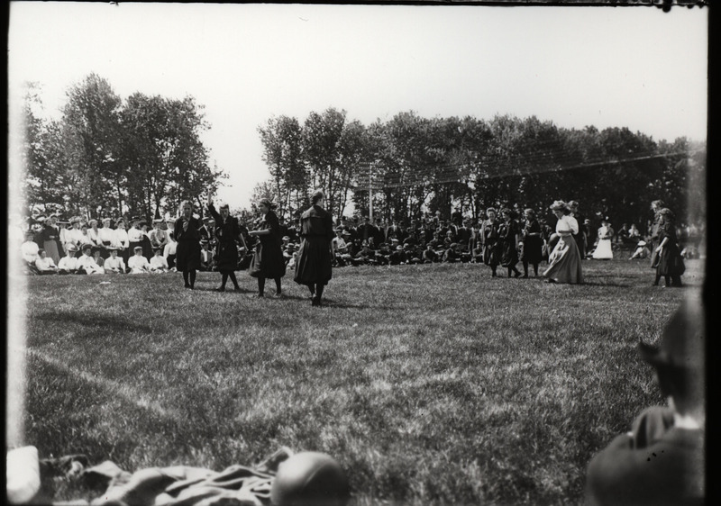 Black and white photograph of women playing a basketball game at Iowa State College in 1908.