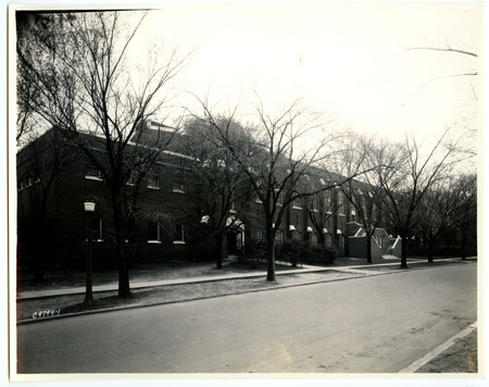 The State Gymnasium sports a new staircase in the center of the front (north) side, viewed from across the road on the northeast through leafless trees.