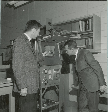 Dan Griffen and Tom Wheelock examine a piece of machinery.