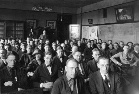 This overcrowded room is the only lecture and recitation room in the Botany Dept. in Central Building (Beardshear Hall). Dr. Pammel is standing at the back of the room.