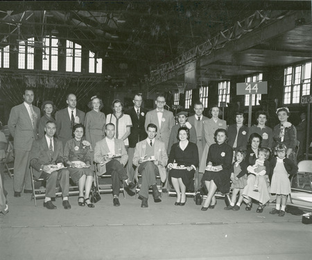 The Alumni Class of 1944 are gathered for a formal photograph at the Homecoming Alumni luncheon.