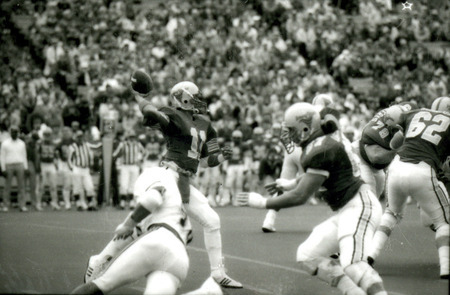The ISU quarterback Alex Espinoza throws a pass during the Homecoming football game against Kansas, 1985.