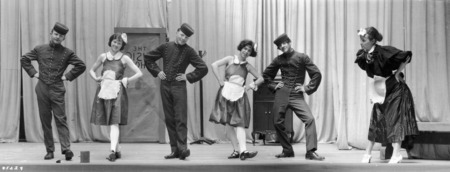 Photograph of three men dressed as bell hops and three women dressed maids for the VEISHEA Nite Show, "Melody Magic." The Nite Show is the predecessor to Stars Over VEISHEA.
