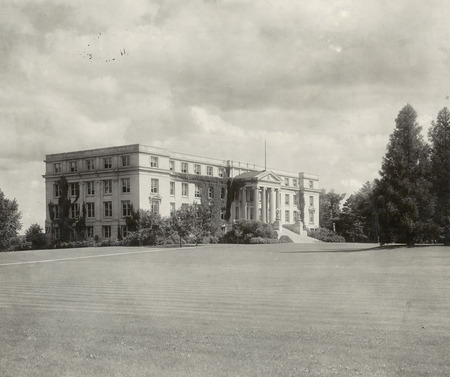 Agriculture Hall (Curtiss Hall) is viewed from the northwest, showing the north and west elevations with ivy starting to grow on the walls.