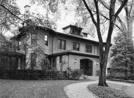 The covered entryway, large open air porch and bricked sidewalk are shown in this 1966 view of the Knoll.