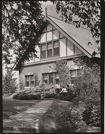 Photograph showing three people outside the entrance to Landscape Architecture.