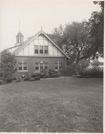 Photograph showing a person standing outside the entrance to Landscape Architecture.