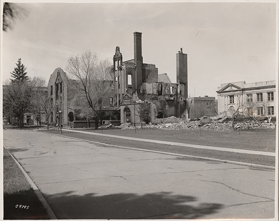 Photograph showing the southeast portion of Margaret Hall after it was destroyed by fire on April 9, 1938. MacKay Hall can be seen to the north (right).