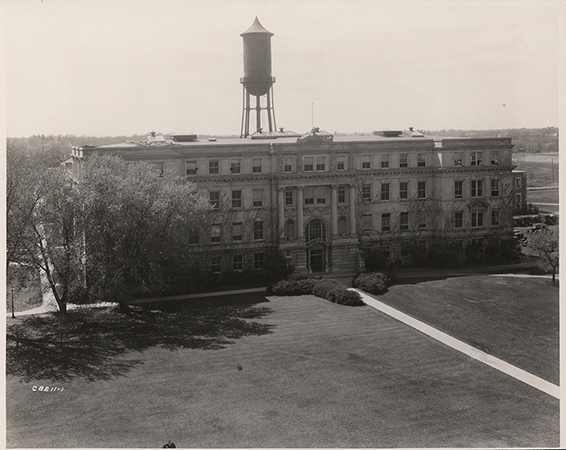 Photograph of the east side of Marston Hall with the Marston Water Tower rising up behind it.