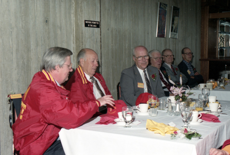 Photograph of Oscar Fletcher visiting with guests at a reception