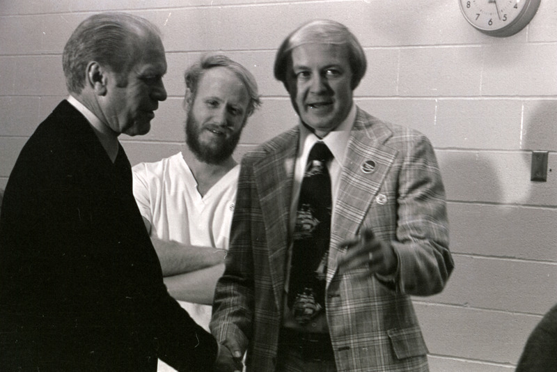 Photograph of the presidential motorcade and Gerald Ford's tour of the Iowa State University College of Veterinary Medicine building