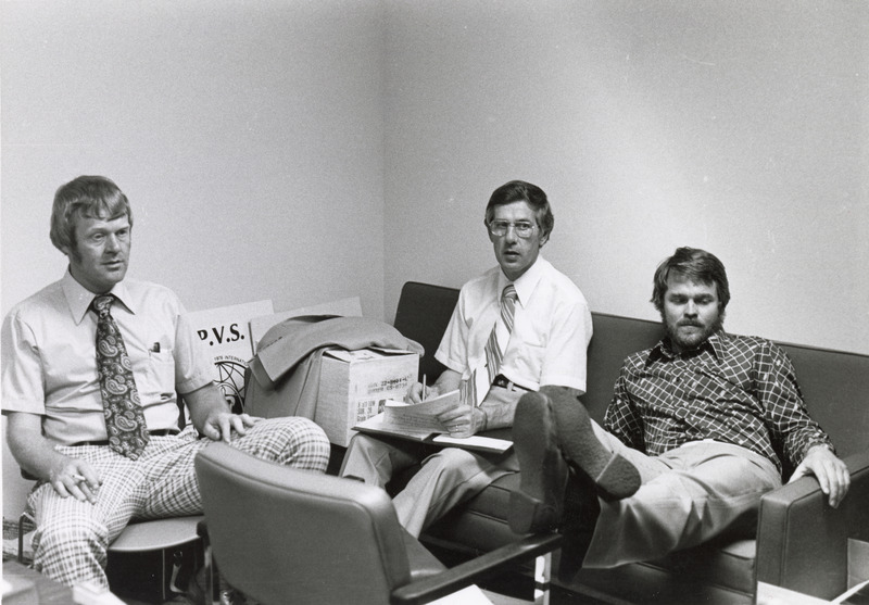 Photograph of three men relaxing on the day of the 1976 International Pig Veterinary Society Congress