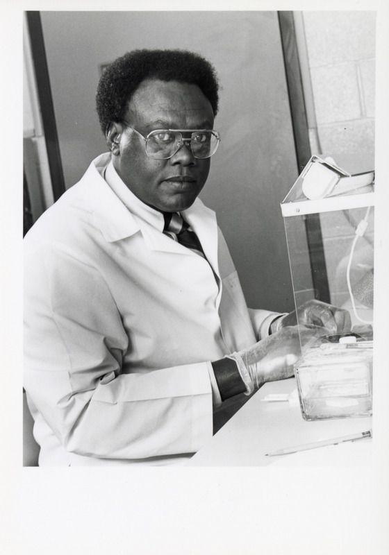 Photograph of Yosiya Niyo performing research in a pathology lab