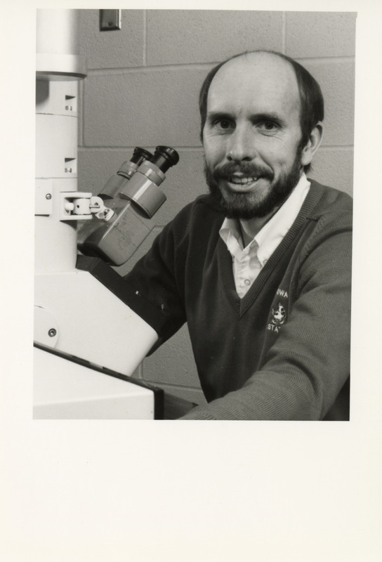 Photograph of Lawrence Arp with transmission electron microscope