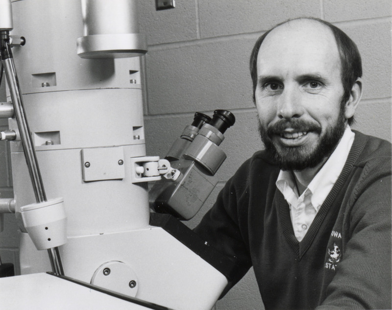 Photograph of Lawrence Arp with transmission electron microscope