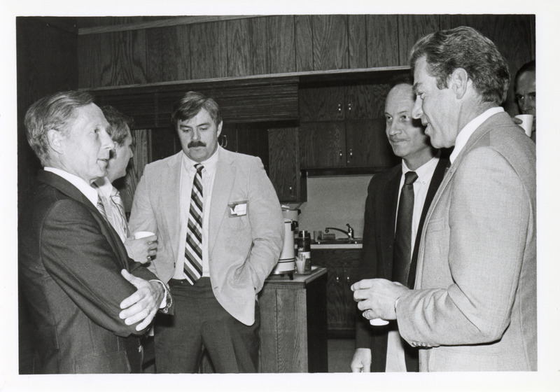 Photograph of people attending an alumni gathering during homecoming