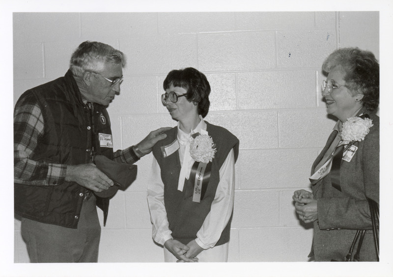 Photograph of Richard Shirbroun greeting Nancy Hartwig at an alumni gathering during homecoming