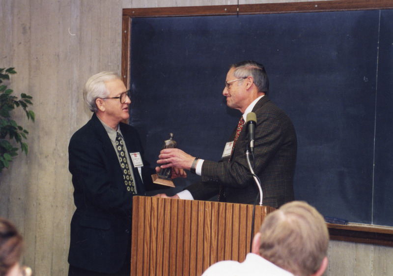 Photograph of Richard Ross presenting the Stange Award to Gabor Vajda