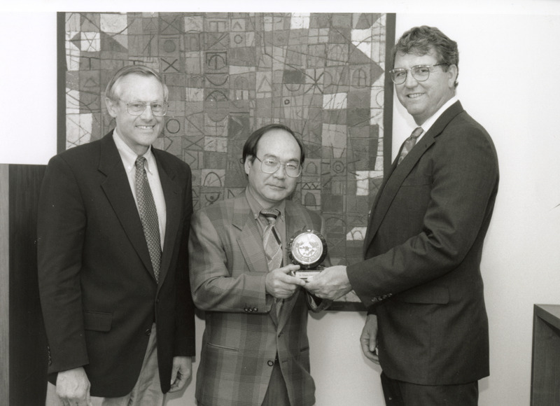 Photograph of Etsuro Uemura receiving an award with Richard Ross on left