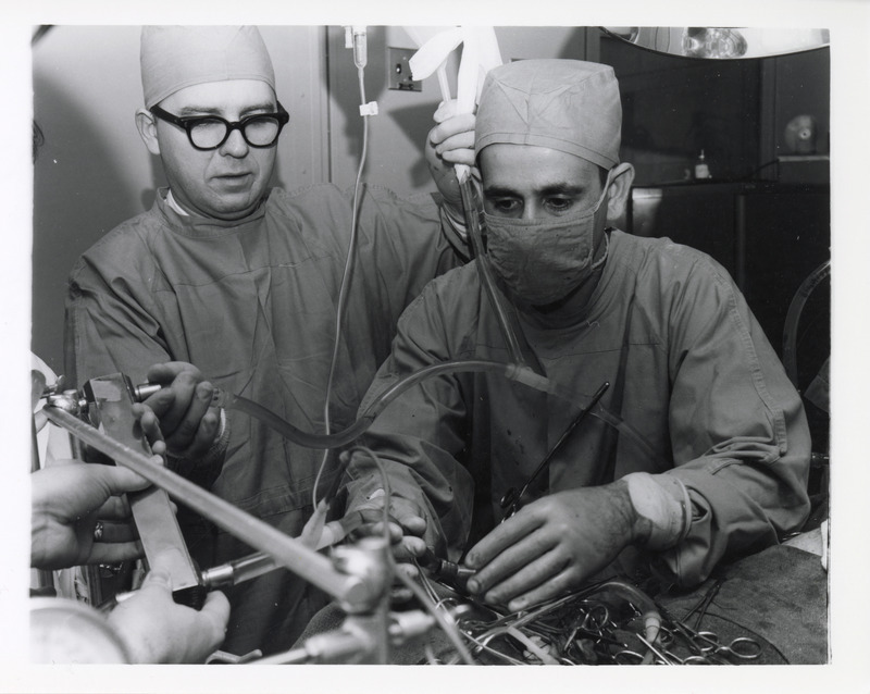 Photograph of Neal Cholvin and Shaheen Al-Nakeeb performing heart surgery
