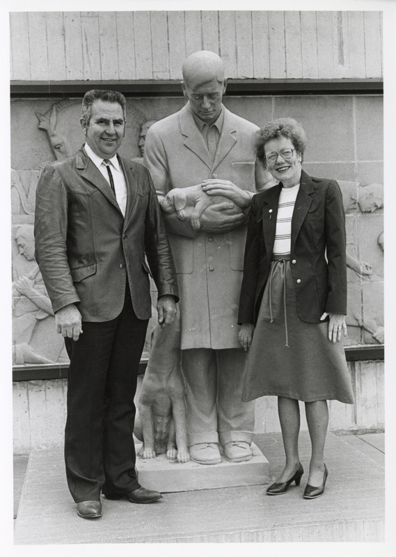Photograph of Stan and Betty Held with Gentle Doctor statue
