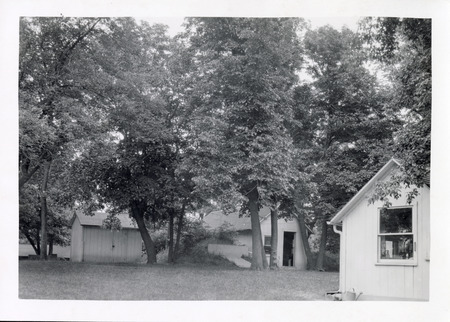 Photograph of the USDA Hog Cholera Station (right) and adjacent sheds located just east of campus