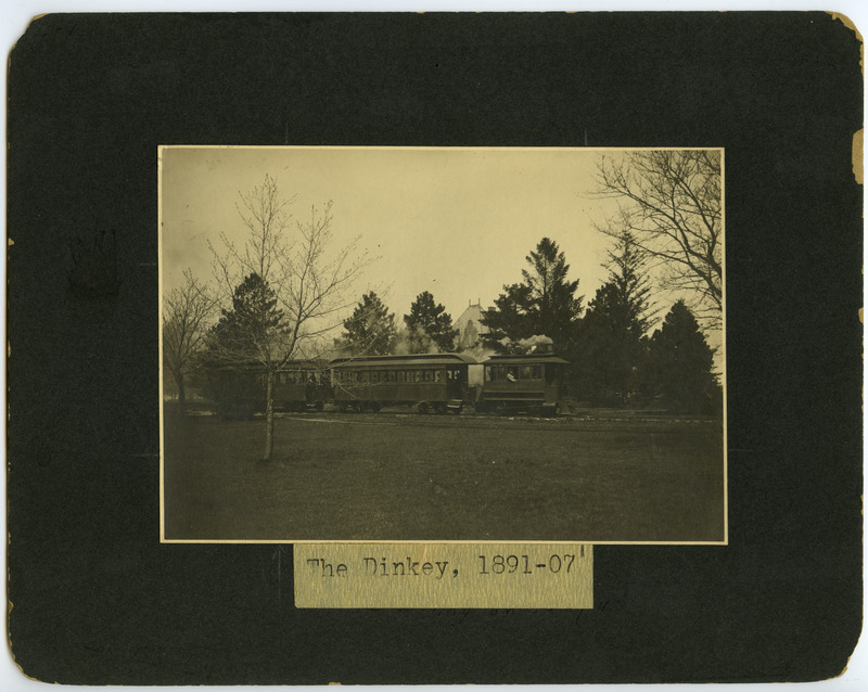 A photograph of the Dinkey steaming across campus.