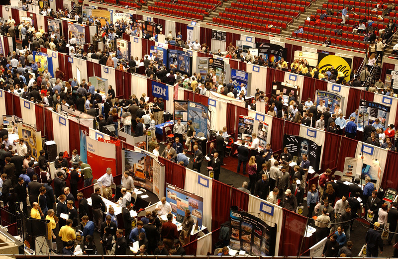 Photograph showing businesses information booths at the College of Engineering Career Fair, held in Hilton Coliseum in 2003.