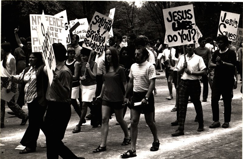 Photograph of Campus Crusade for Christ members in the 1970 VEISHEA parade. The students are part of an anti-war protest following the shooting at Kent State.