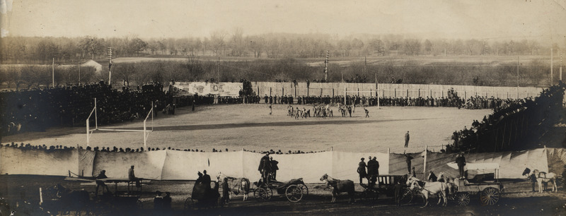 Photograph of athletic field during a football game. The athletic fields were north of Marston Hall from 1893 until 1914.