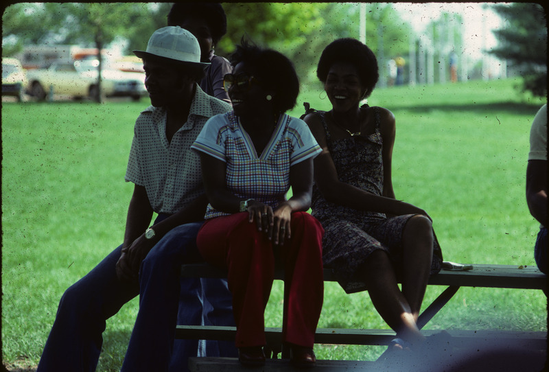 Photograph showing picnic-goers at an event held by the Office of Minority Students Program at Iowa State University.