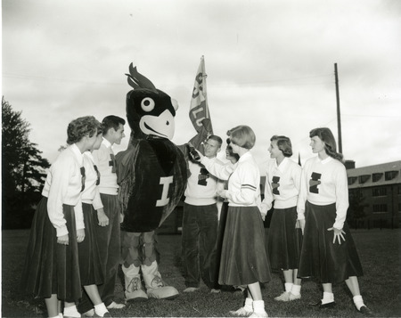 Photograph showing the Pep Council introducing Iowa State University new mascot, Cy the Cardinal.