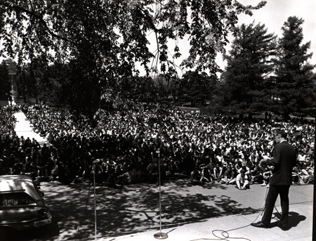Photograph taken from the stairs of Curtis Hall, showing students attending an anti-war/pro-peace rally in response to the Kent State shooting. This rally took place before law enforcement or the Board of Regents began objecting to the nature of the protests.