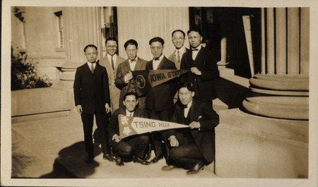 Photograph of a group of Tsing Hua University (Beijing, China) graduates who attended Iowa State College. Only a few of the individuals are identified: Chaucer Chang is at the tip of the Tsing Hua pennant and Kung Fan-Chi is at the other end. Cheng Shaochiung is in the center of the Iowa State banner.
