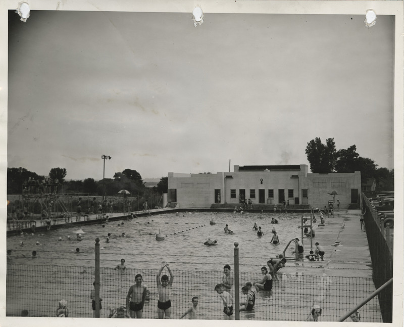 Photograph of people using the Dubuque municipal swimming pool