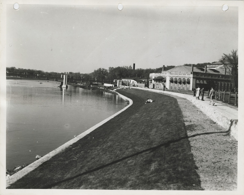 Photograph of people walking on a levee in Iowa City