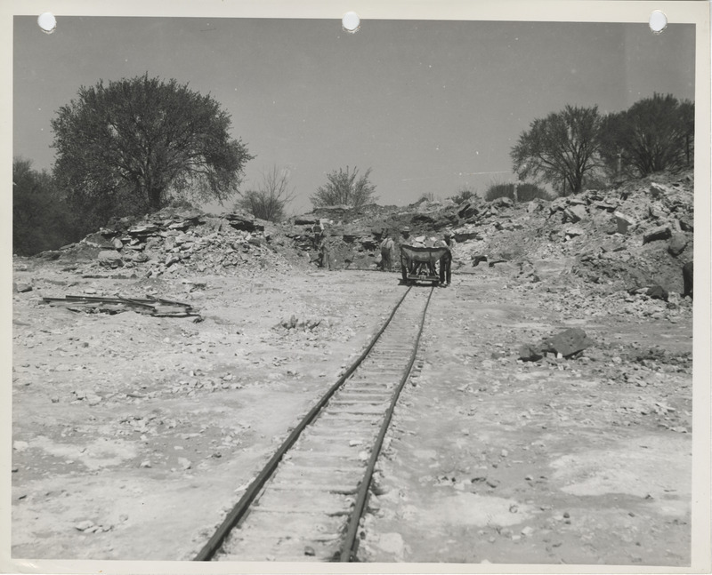 Photograph of people pushing a trolly at a quarry near Columbus Junction